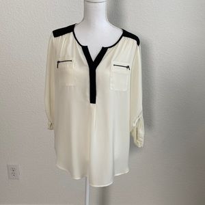 Cream and black blouse